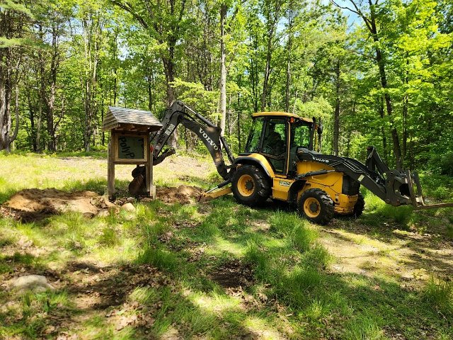 May 2025 - Flint Road: Setting the kiosk outside and behind the new parking area.