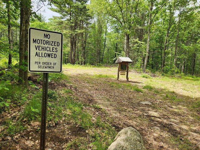 May 2025 - Flint Road: A closer look at the rear of the parking area showing the No Motorized Vehicles Allowed sign and the Kiosk.