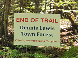 Closeup of End of Trail sign posted on Dennis Lewis Town Forest